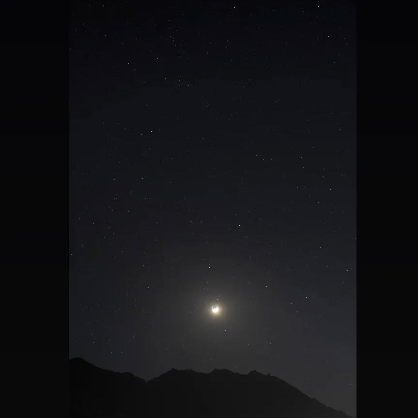 *An exposure blend of the setting crescent moon and earthshine.*